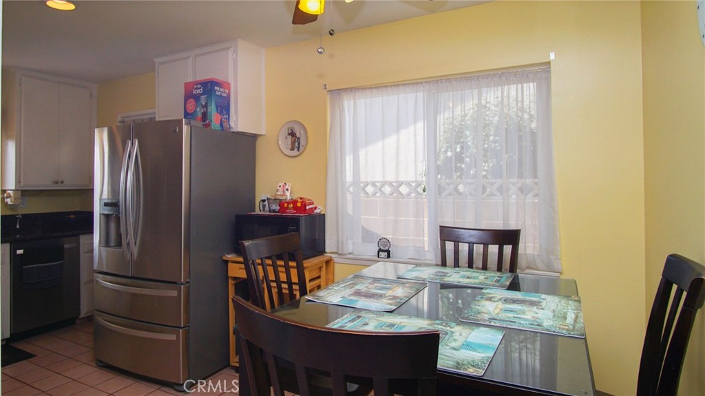 911 East Evergreen Avenue Santa Maria, CA 93454 - Photo 36 of 48 a kitchen with stainless steel appliances granite countertop a refrigerator and a stove top oven