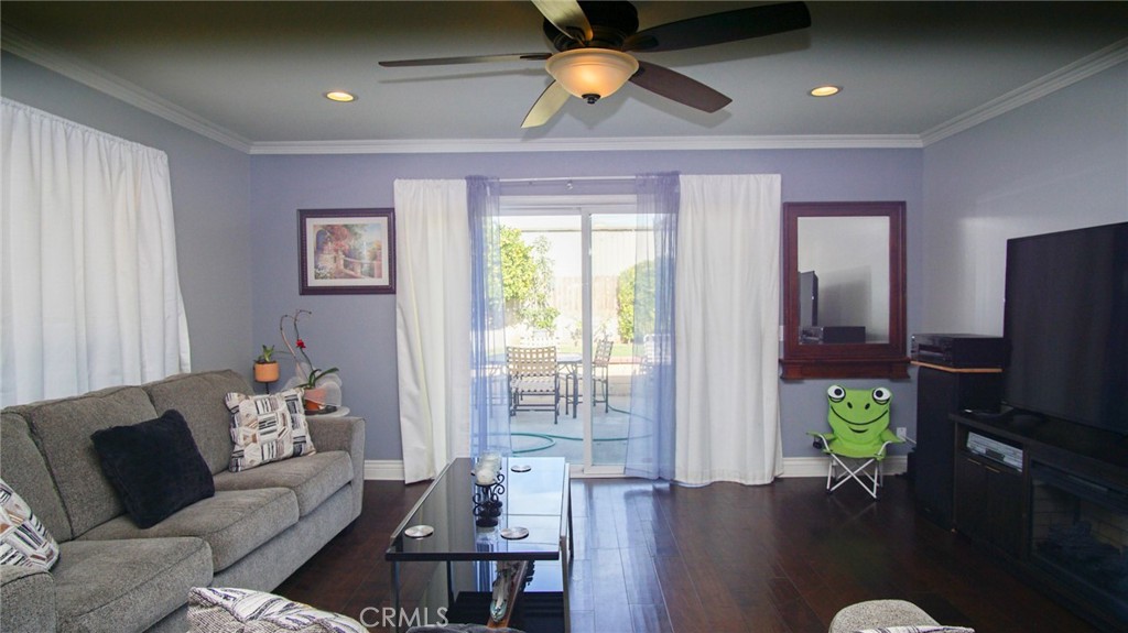 911 East Evergreen Avenue Santa Maria, CA 93454 - Photo 38 of 48 a living room with furniture and a flat screen tv