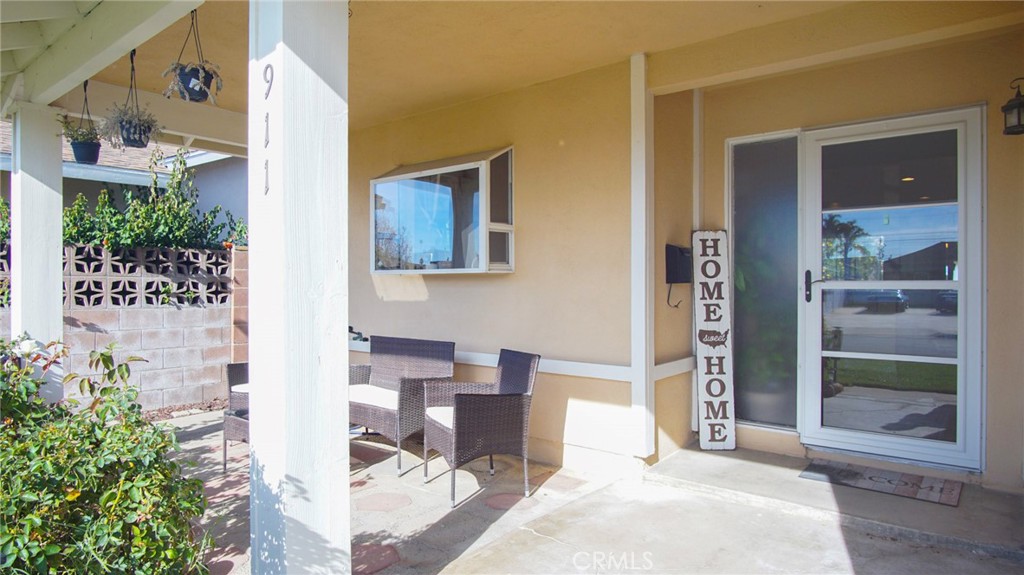911 East Evergreen Avenue Santa Maria, CA 93454 - Photo 5 of 48 a balcony with table and chairs