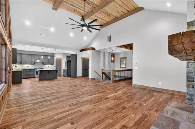 a kitchen with stainless steel appliances granite countertop a stove microwave and cabinets