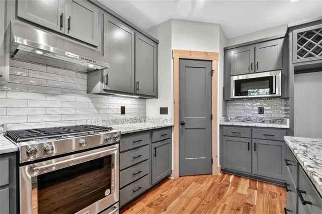 a bath tub sitting in a bathroom next to a window