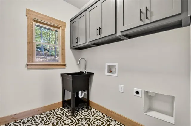 a bathroom with a granite countertop sink toilet a mirror and shower