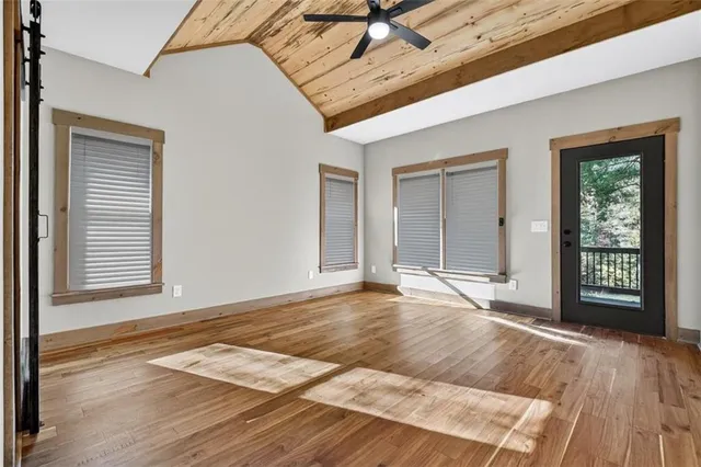 a view of living room with furniture and a fireplace