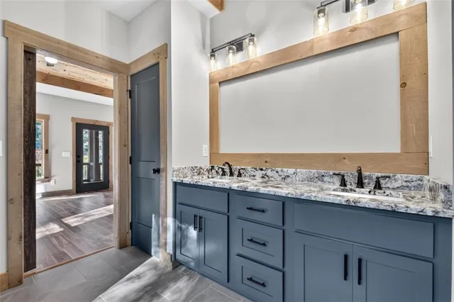 a kitchen with stainless steel appliances granite countertop a stove and a wooden floors