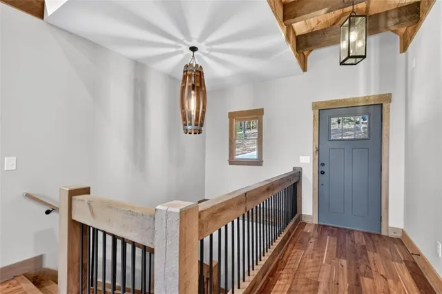 a bathroom with a granite countertop sink a toilet and a shower