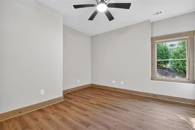 a view of a small house with a yard