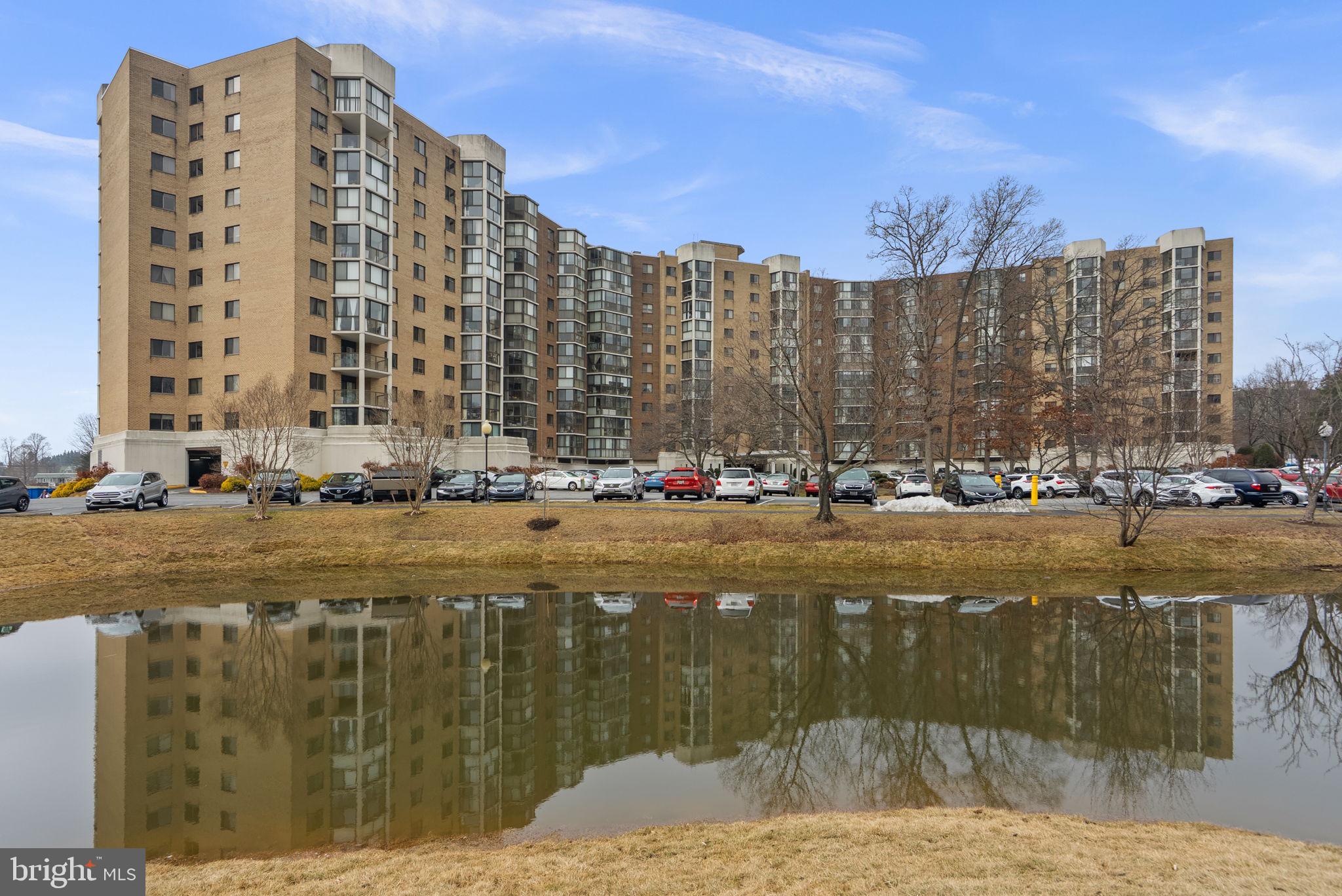 a large building with a lake view