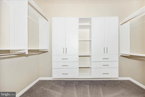 a view of an empty walk in closet