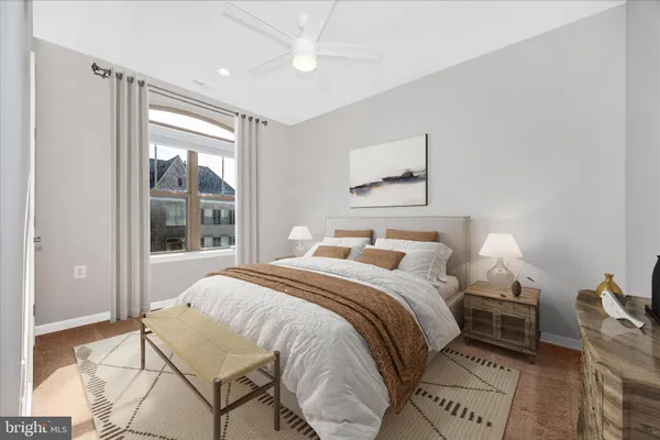 a bedroom with a bed and a window