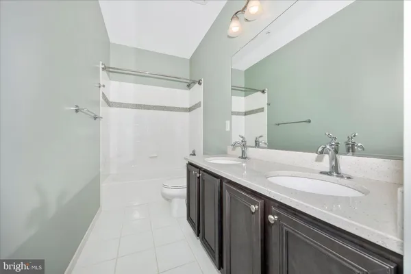 a bathroom with a sink a mirror and a shower