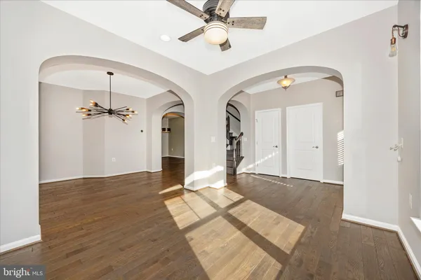 a view of an entryway with a chandelier fan