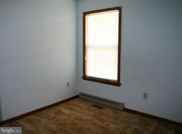 92 Truman Road Inwood, WV 25428 - Photo 2 of 11 an empty room with a window
