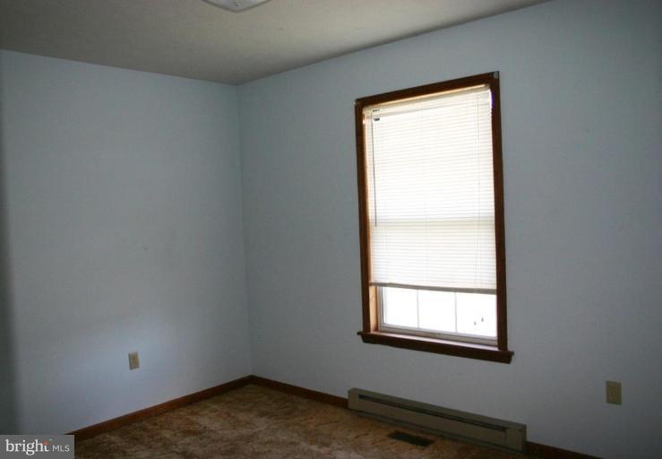 92 Truman Road Inwood, WV 25428 - Photo 3 of 11 an empty room with a window