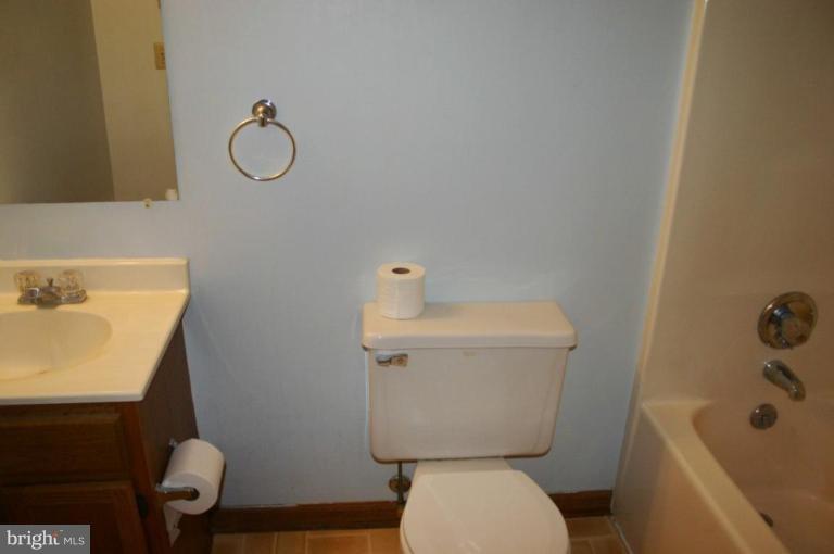 92 Truman Road Inwood, WV 25428 - Photo 4 of 11 a white toilet sitting next to a bathroom sink
