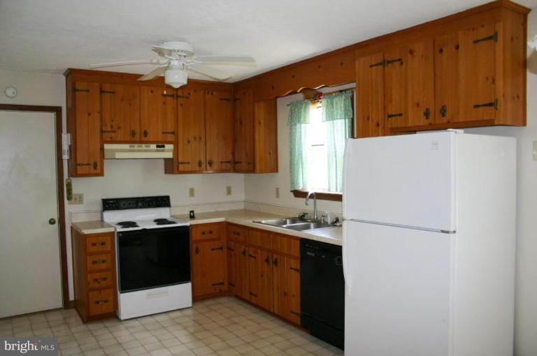 92 Truman Road Inwood, WV 25428 - Photo 5 of 11 a kitchen with a sink a stove and refrigerator