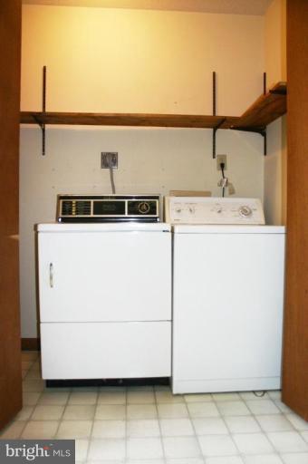 92 Truman Road Inwood, WV 25428 - Photo 6 of 11 a utility room with dryer and washer