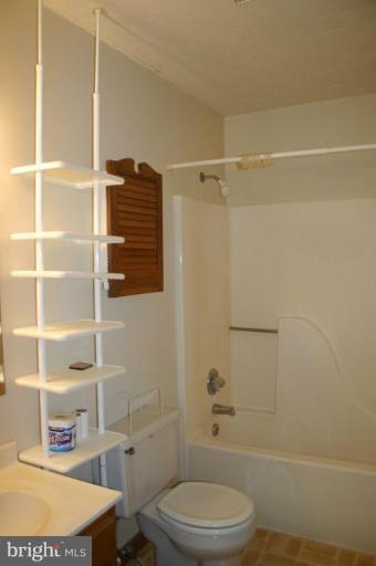 92 Truman Road Inwood, WV 25428 - Photo 8 of 11 a bathroom with a toilet and a shower