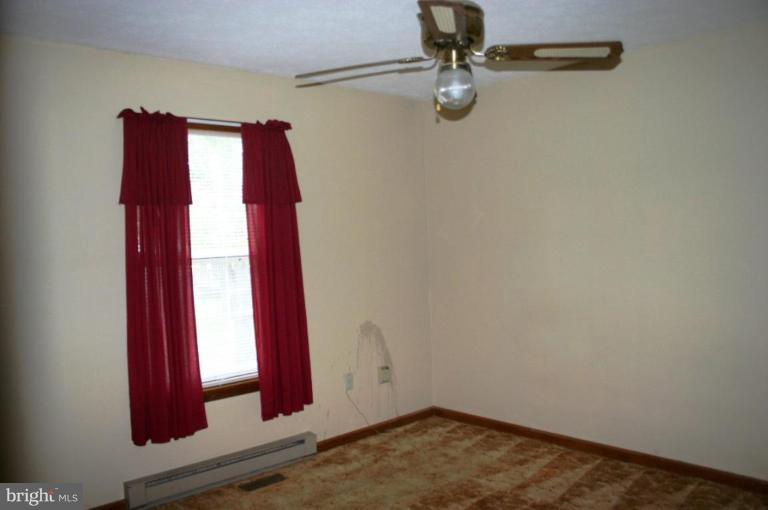 92 Truman Road Inwood, WV 25428 - Photo 9 of 11 a view of a room with a fan and a window