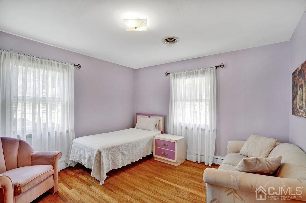 1 Sulliman Road Edison, NJ 08817 - Photo 15 of 24 a bedroom with a bed and a couch