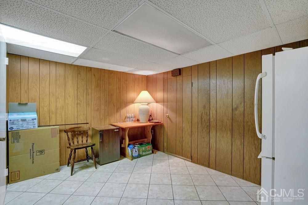 1 Sulliman Road Edison, NJ 08817 - Photo 18 of 24 a room with a table chair and chandelier