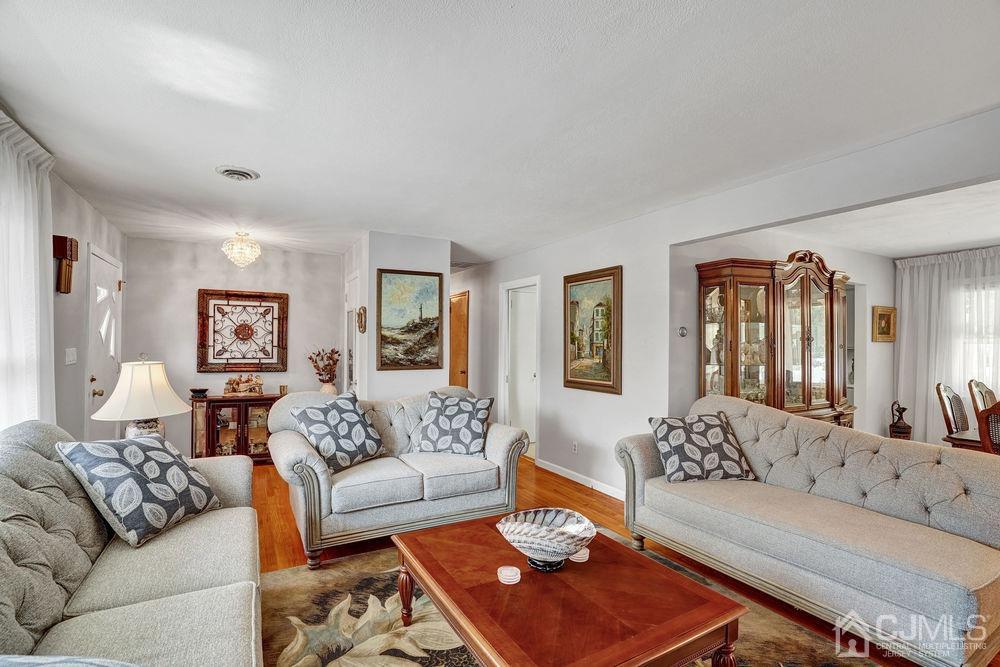 1 Sulliman Road Edison, NJ 08817 - Photo 6 of 24 a living room with furniture rug and window