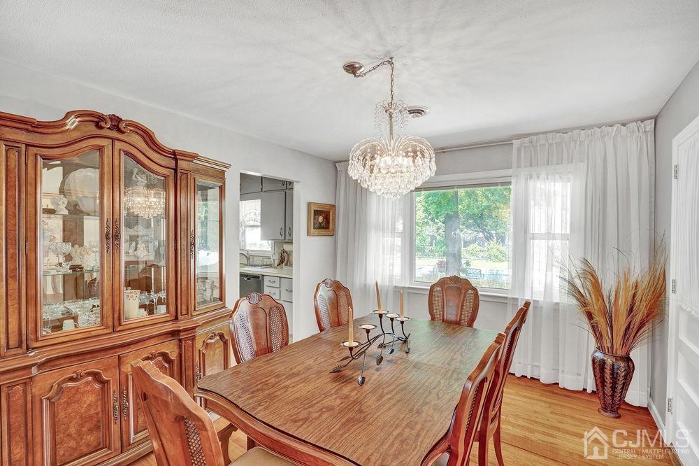 1 Sulliman Road Edison, NJ 08817 - Photo 7 of 24 a view of a dining room with furniture window and outside view