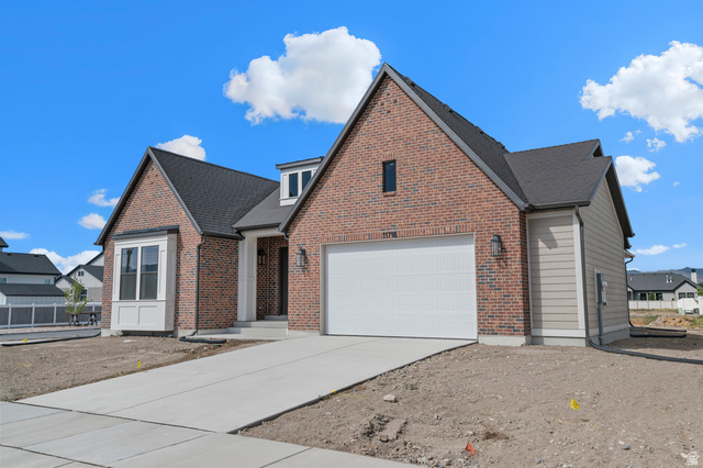 11718 South Halls Crk Road Draper, UT 84020 - Photo 3 of 28 Brick and siding exterior featuring a prominent two-car garage