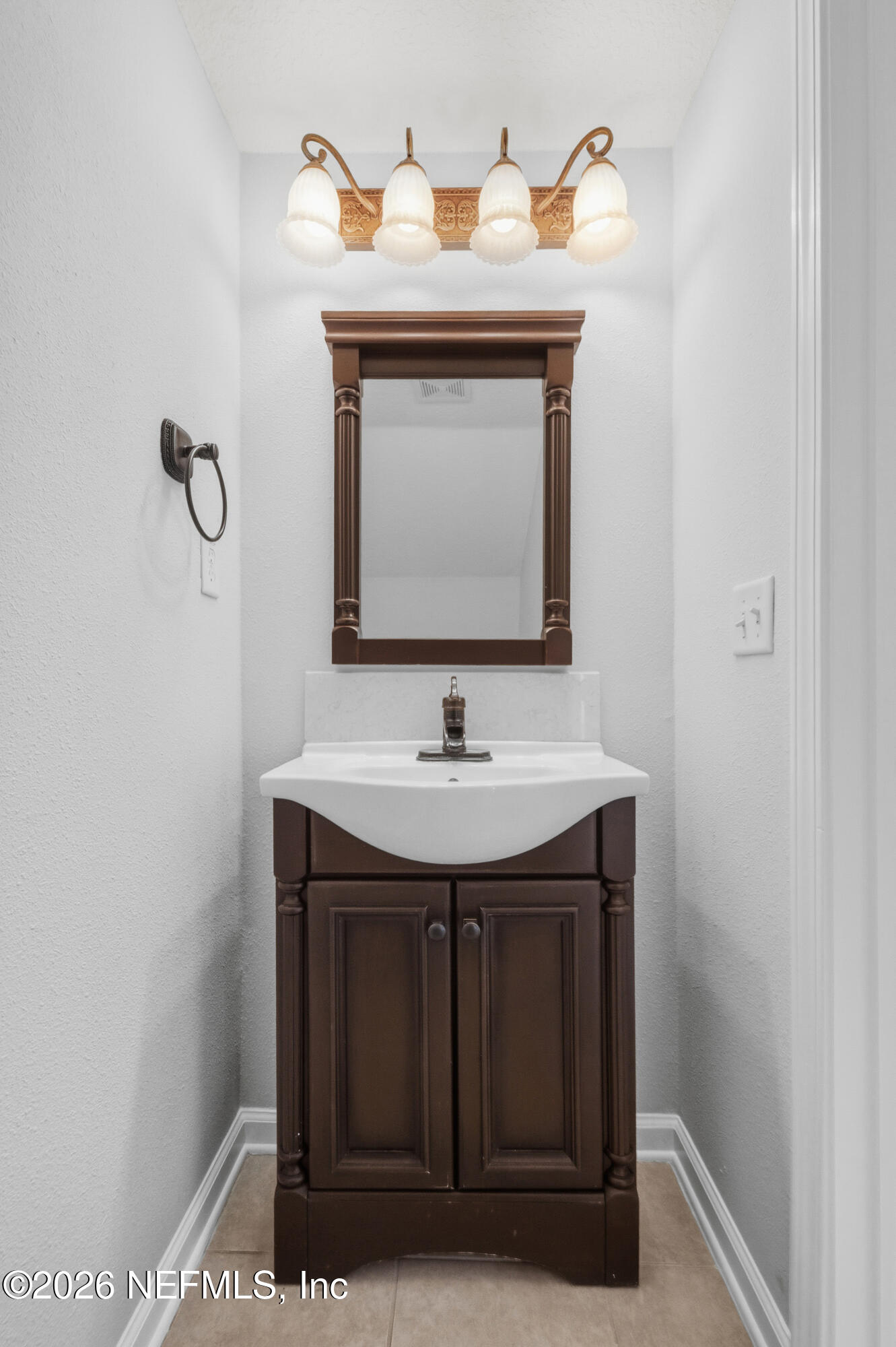 6700 Bowden Road, Unit 1004 Jacksonville, FL 32216 - Photo 11 of 25 a bathroom with a sink and a mirror