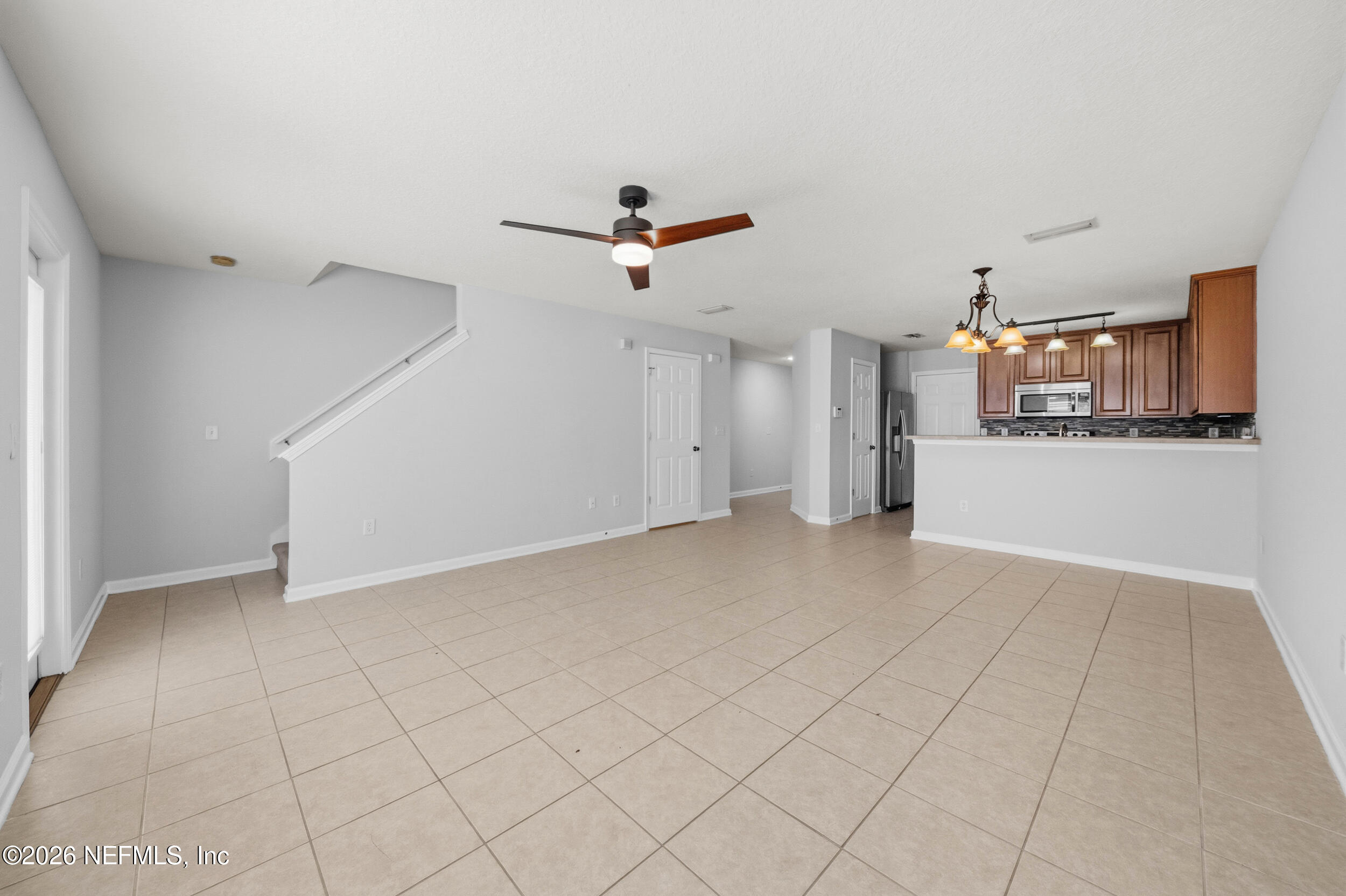 6700 Bowden Road, Unit 1004 Jacksonville, FL 32216 - Photo 12 of 25 an empty room with closet and a ceiling fan