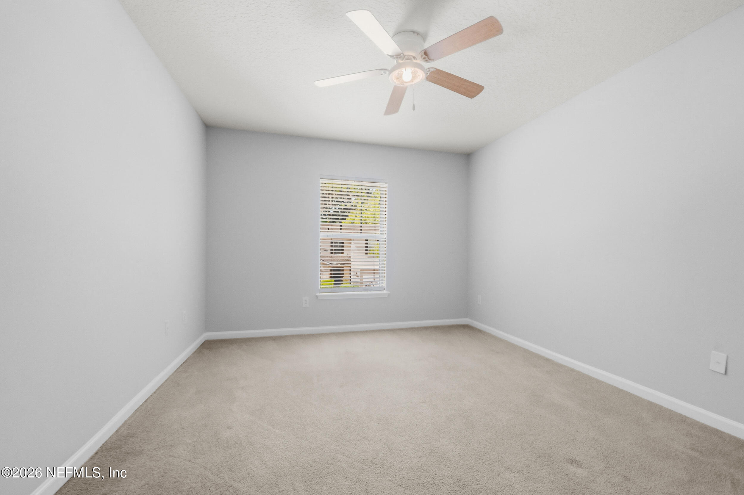 6700 Bowden Road, Unit 1004 Jacksonville, FL 32216 - Photo 20 of 25 an empty room with a window and a fan