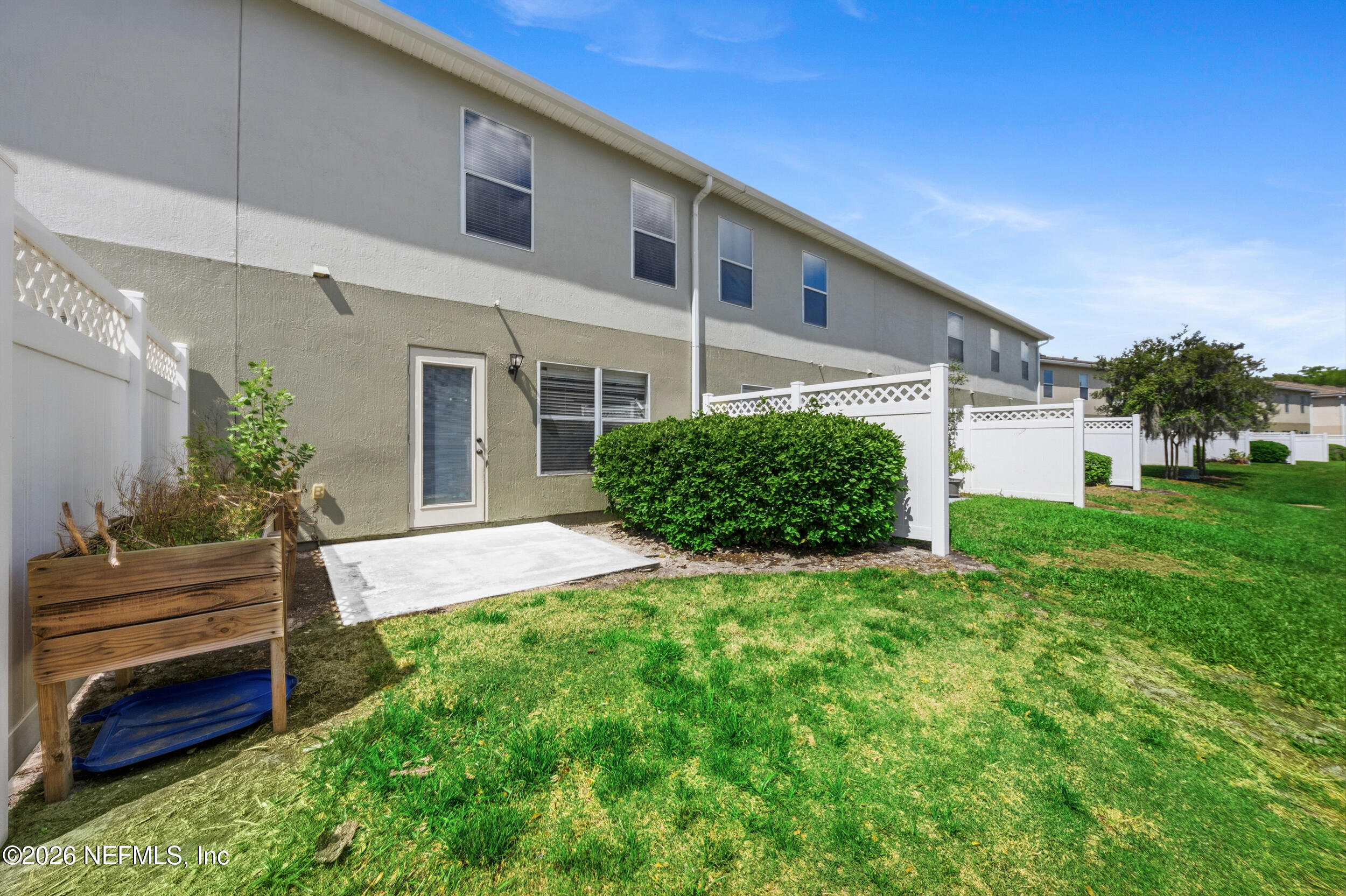 6700 Bowden Road, Unit 1004 Jacksonville, FL 32216 - Photo 23 of 25 a view of a house with backyard and garden