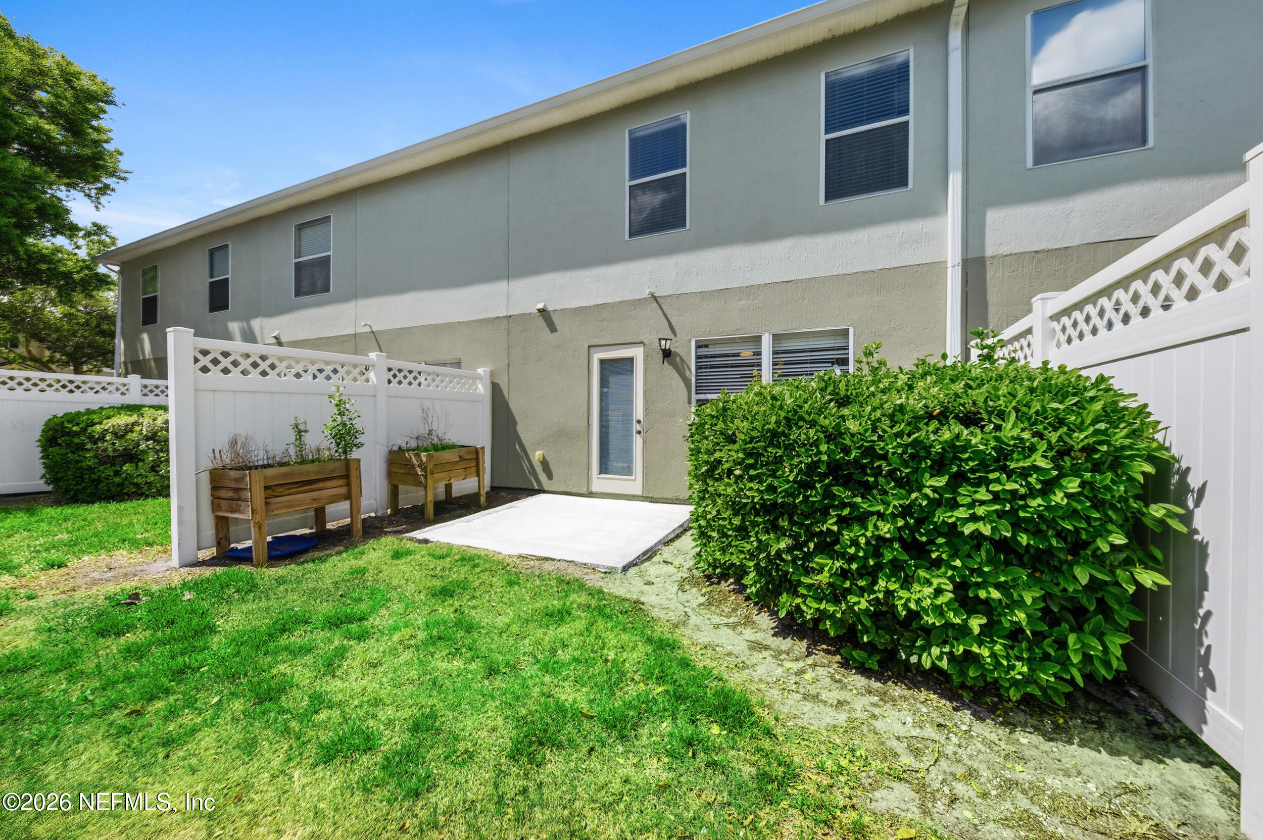 6700 Bowden Road, Unit 1004 Jacksonville, FL 32216 - Photo 24 of 25 a view of a house with a yard