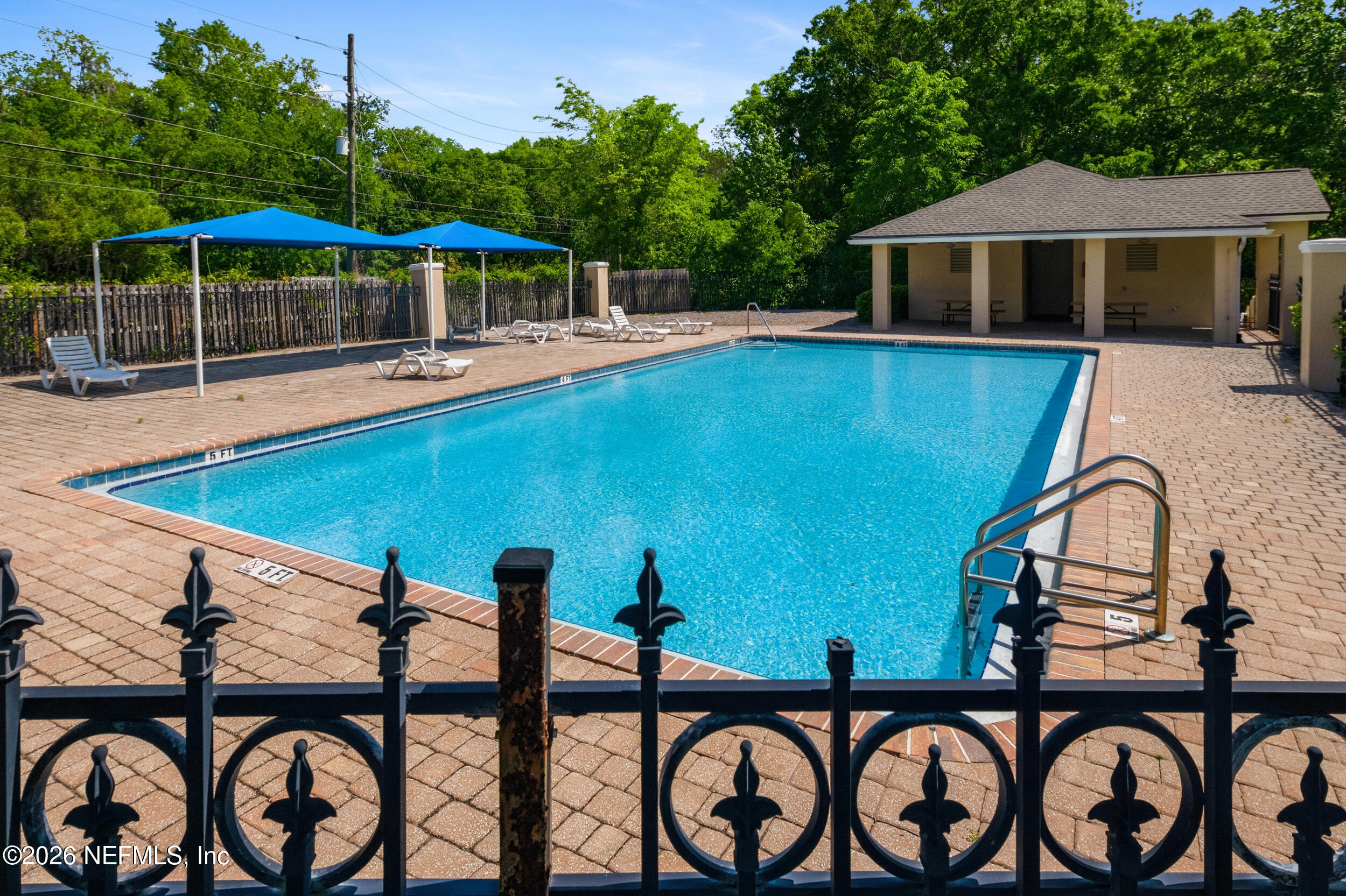 6700 Bowden Road, Unit 1004 Jacksonville, FL 32216 - Photo 25 of 25 a view of a swimming pool with a patio