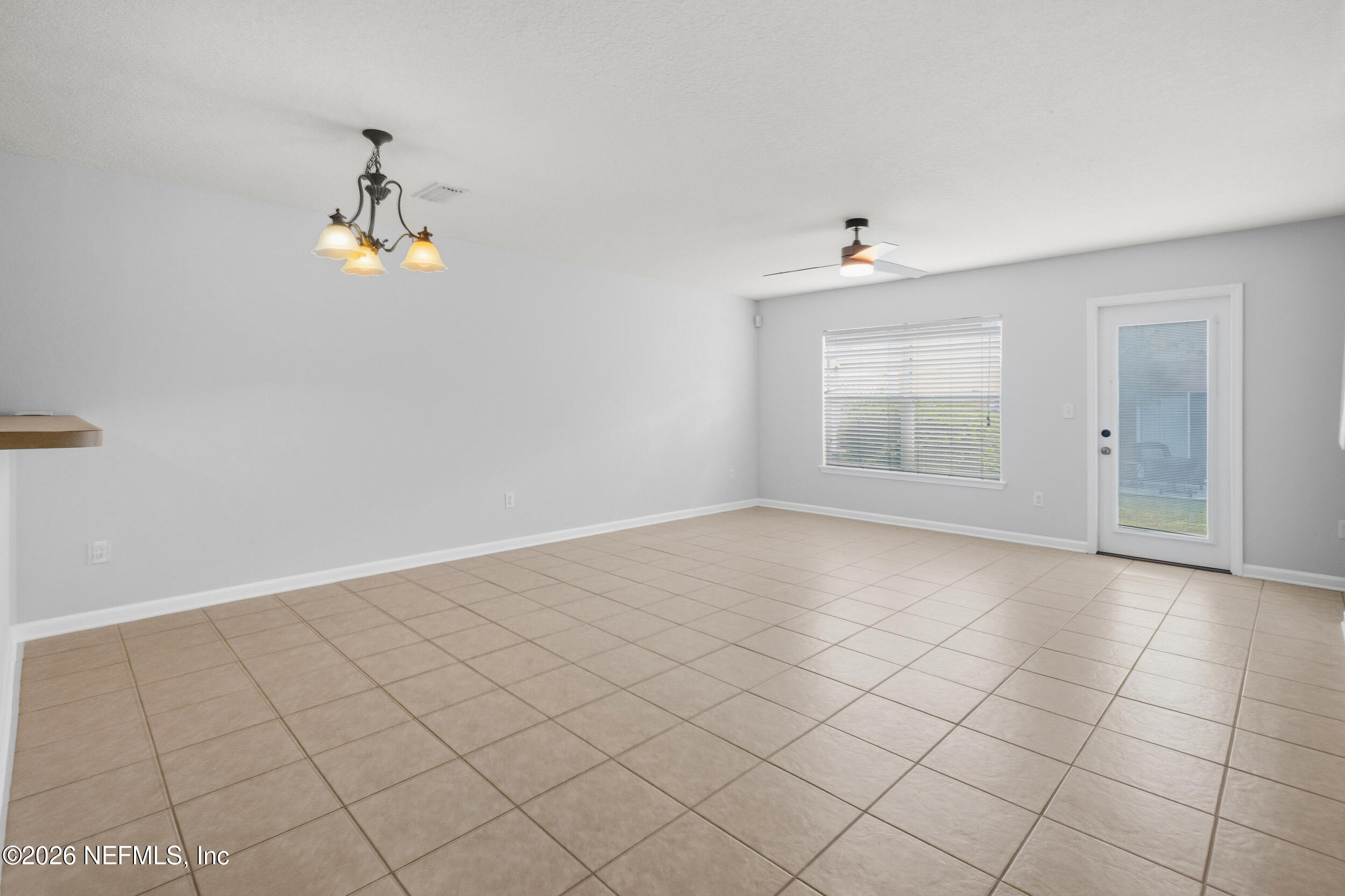 6700 Bowden Road, Unit 1004 Jacksonville, FL 32216 - Photo 5 of 25 an empty room with windows