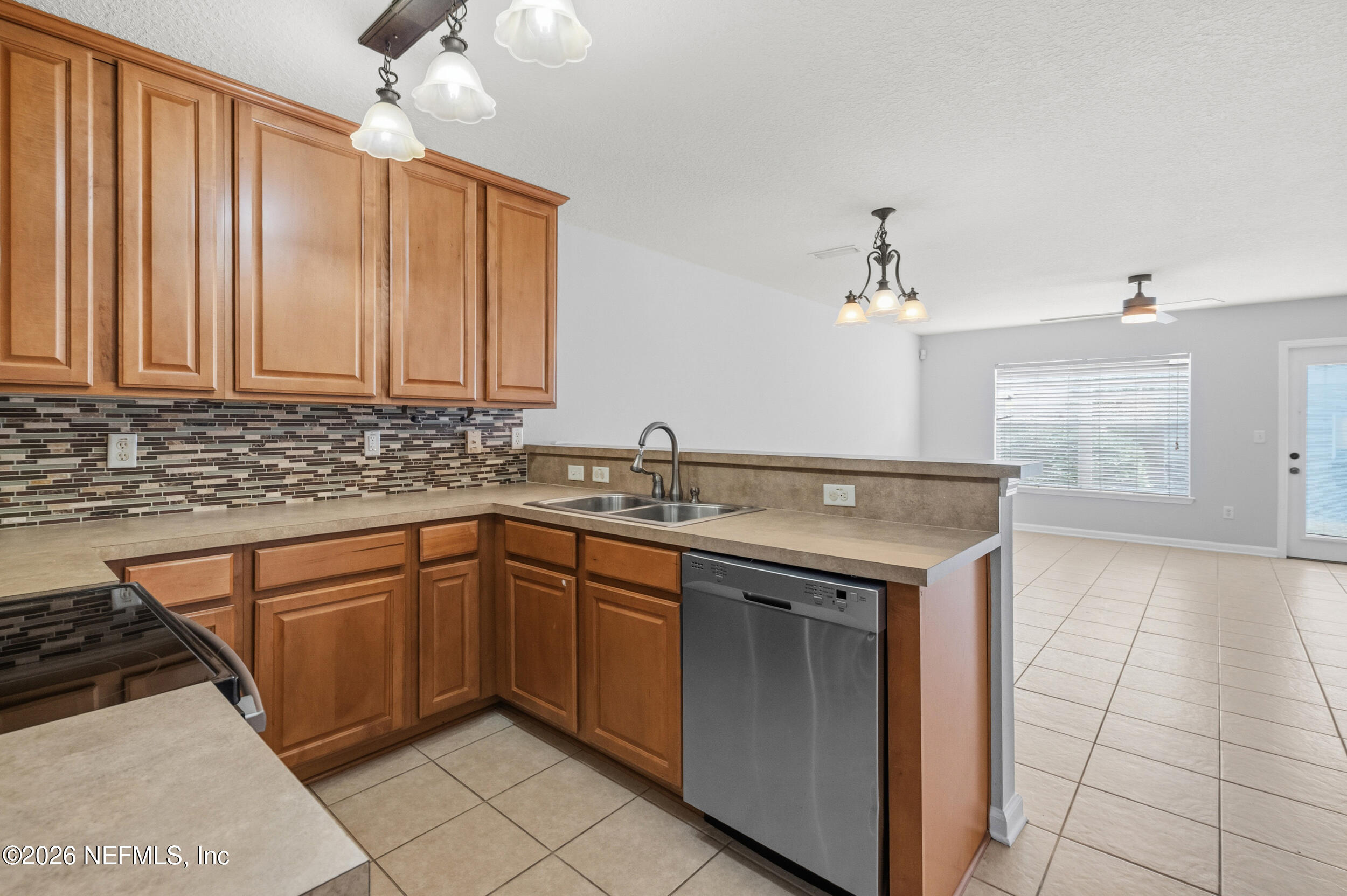 6700 Bowden Road, Unit 1004 Jacksonville, FL 32216 - Photo 7 of 25 a kitchen with stainless steel appliances granite countertop a sink and cabinets