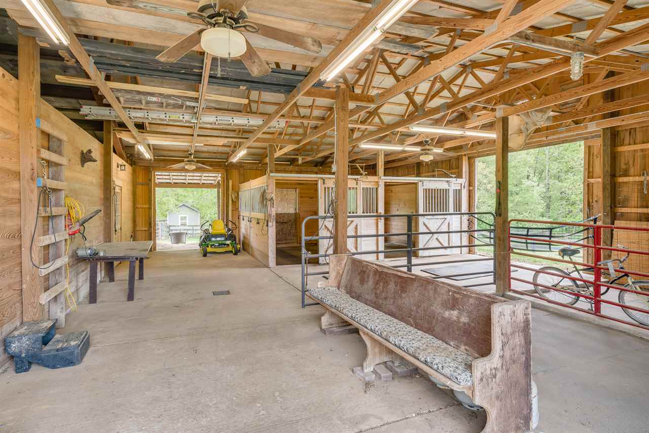 750 Anderson Road Moscow, TN 38057 - Photo 22 of 25 2 existing stall with access to turn out, with room for 2 more. Hot and cold water, cross ties, temperature controlled tack room with sink and little fridge. Bathroom off of workshop plumbed for shower.