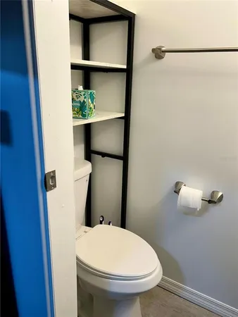a bathroom with a toilet and a sink