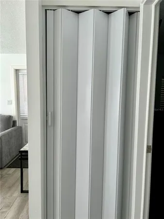 a close view of closet with wooden floor