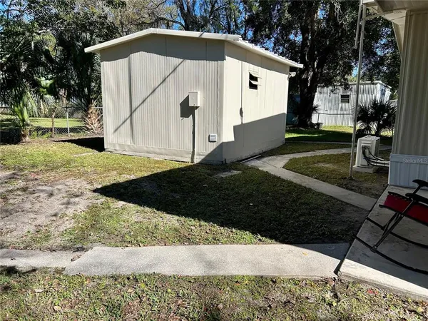 a view of a back yard of the house