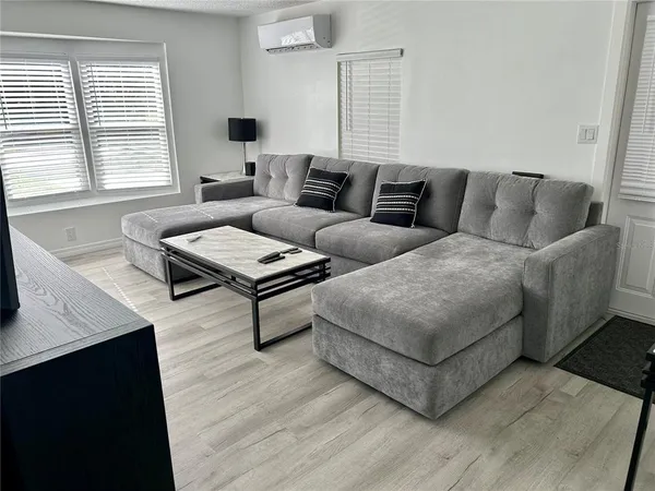 a living room with furniture and a window