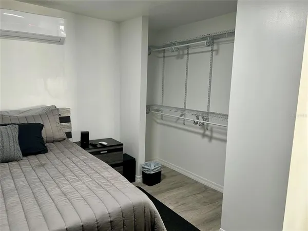 a bedroom with a bed and a fireplace