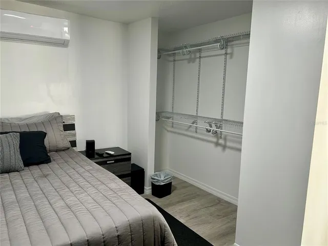 a bedroom with a bed and a fireplace