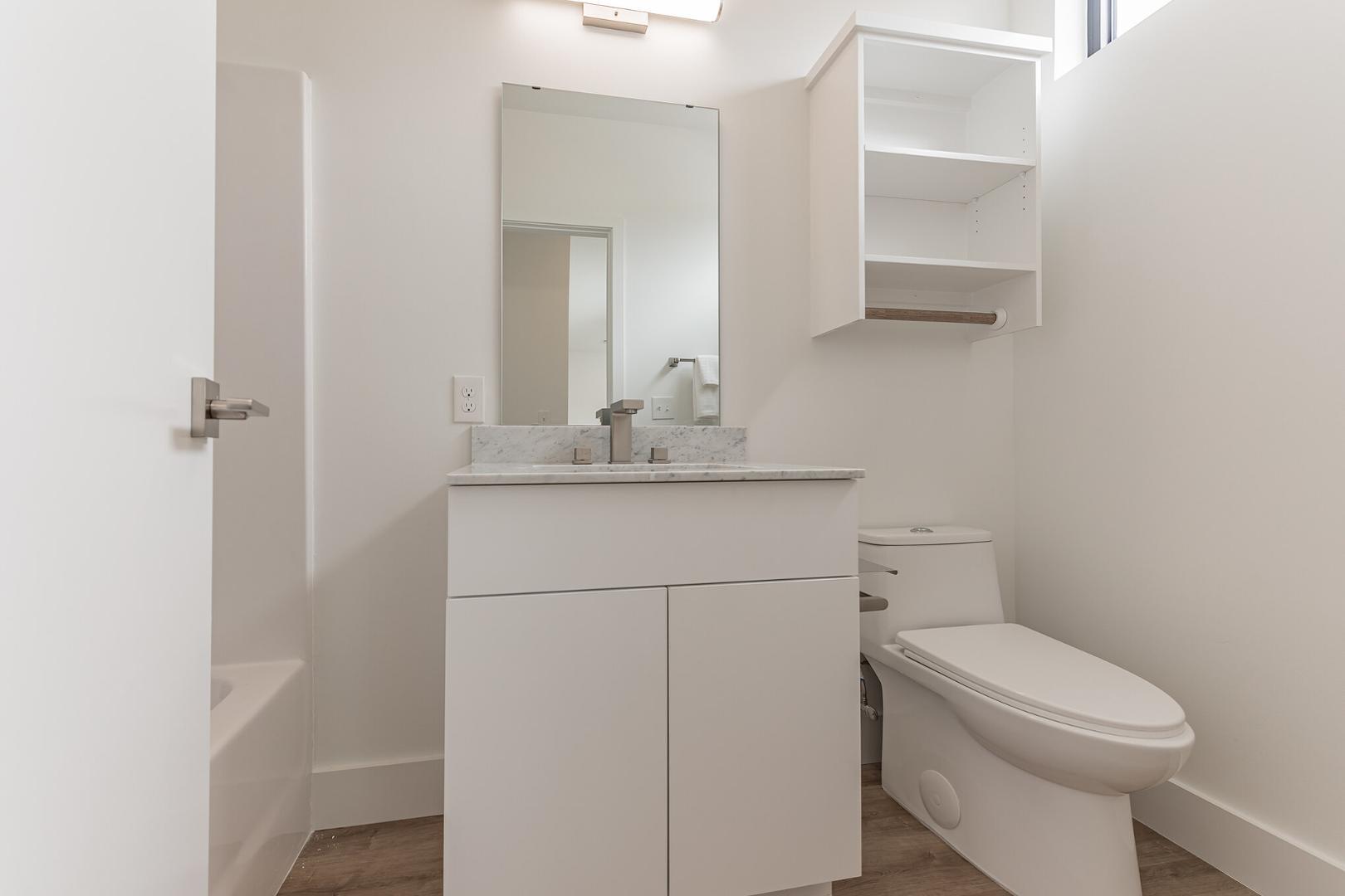 2015 Jade Street Durham, NC 27713 - Photo 23 of 31 a bathroom with a sink toilet and vanity