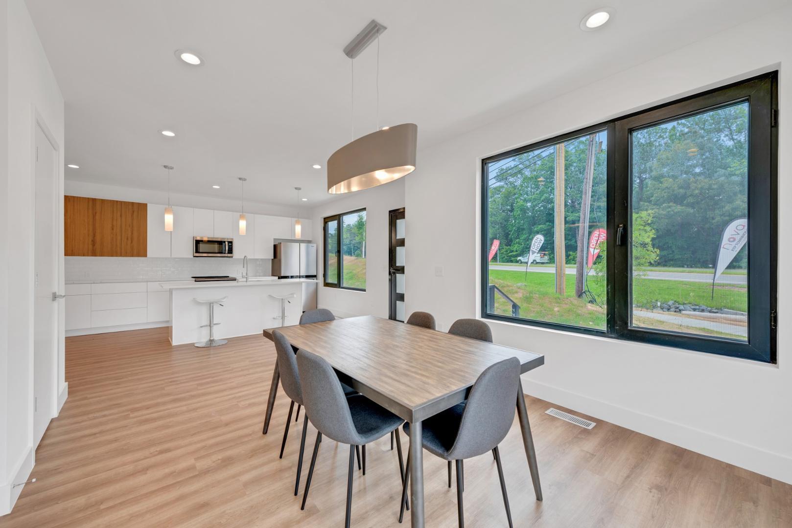 2015 Jade Street Durham, NC 27713 - Photo 4 of 31 a view of a kitchen with a table and chairs