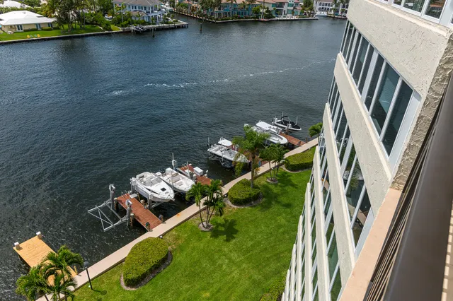 an aerial view of a house with a lake view