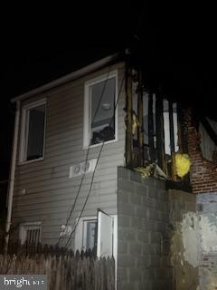 1823 Ramsay Street Baltimore, MD 21223 - Photo 16 of 19 a view of a porch with a table and chairs