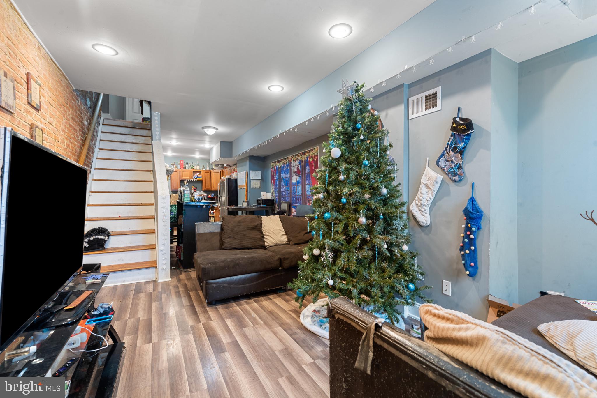 1823 Ramsay Street Baltimore, MD 21223 - Photo 5 of 19 a living room with furniture and a flat screen tv