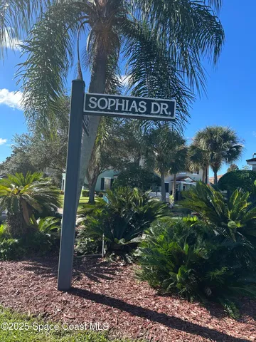 a view of a street sign next to a road
