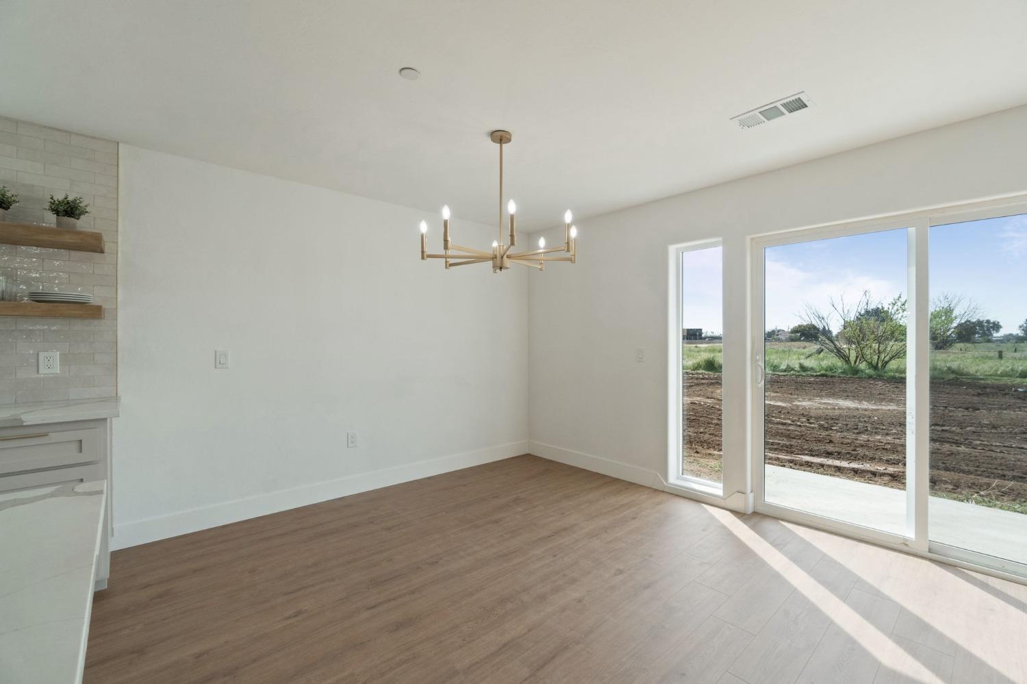 25918 Tanforan Drive Madera, CA 93638 - Photo 18 of 37 a view of an empty room with a window