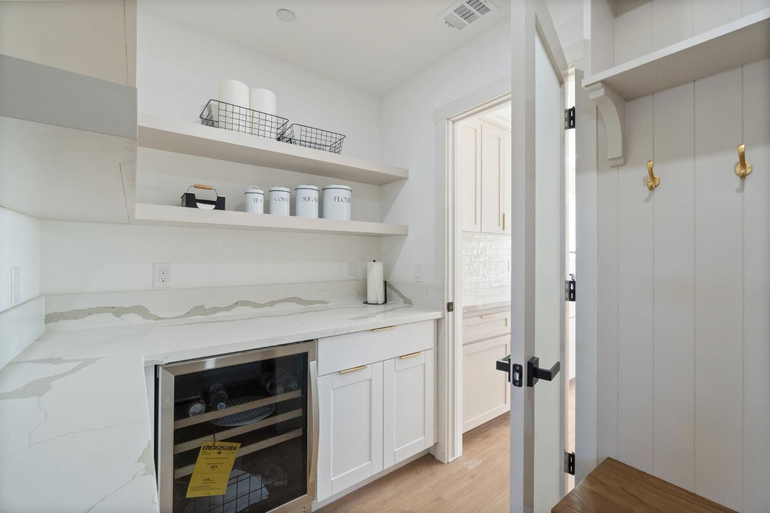 25918 Tanforan Drive Madera, CA 93638 - Photo 20 of 37 a kitchen with a stove and a cabinet